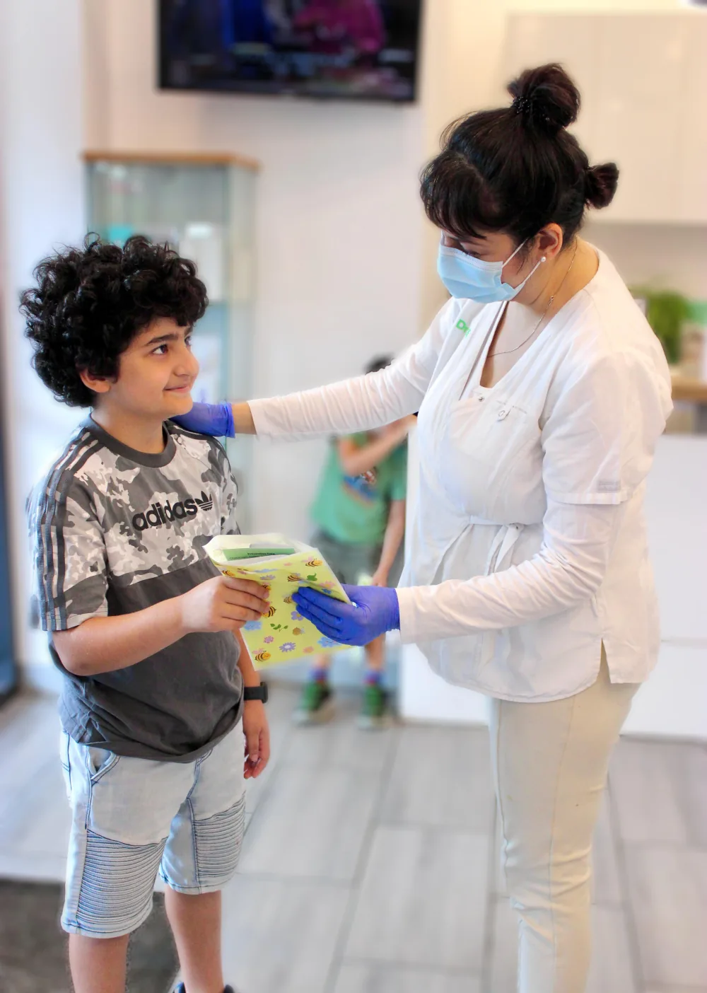 Child receiving a prize after a dental visit at Orchard Smiles in Blackburn North