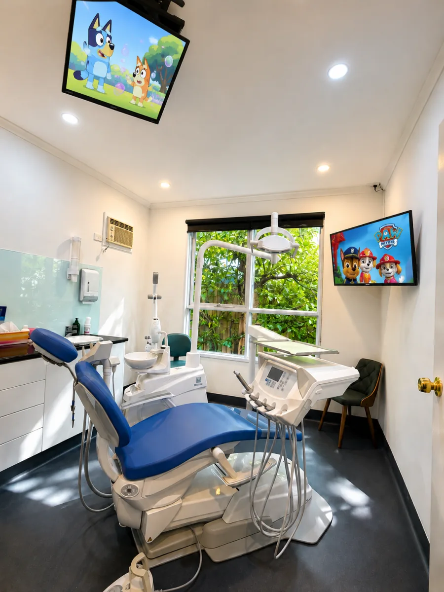 Orchard Smiles treatment room with ceiling-mounted television in Blackburn North