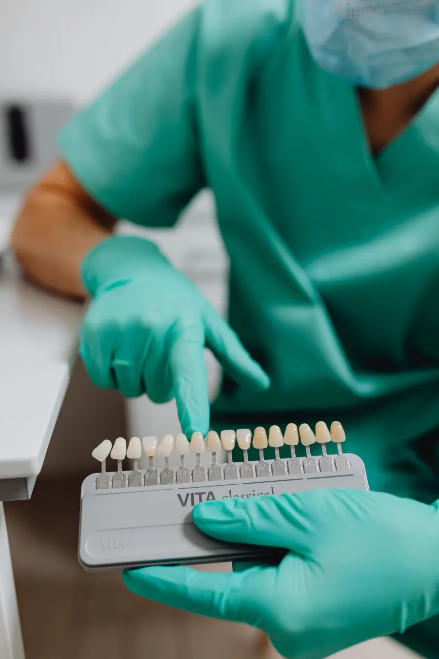 Dental shade guide used during a teeth whitening suitability discussion